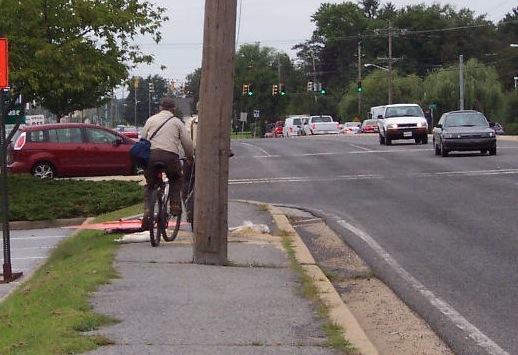 riding bike on sidewalk